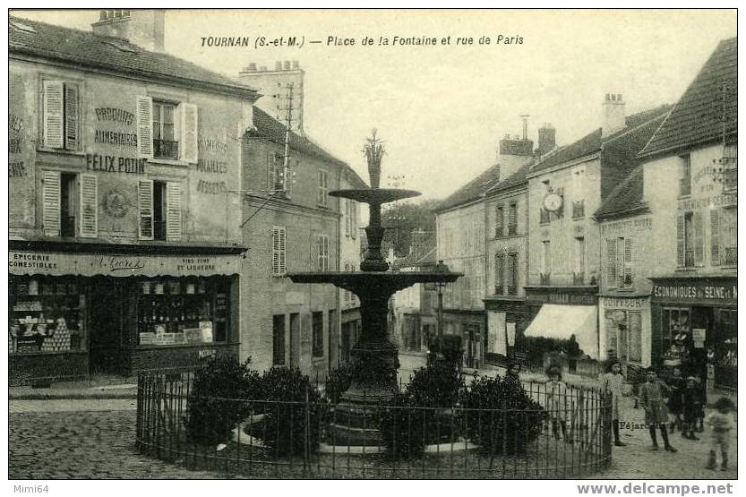 77 .  TOURNAN .   PLACE DE LA FONTAINE ET RUE DE PARIS .  (  COMMERCES  FELIX POTIN  ) - Tournan En Brie