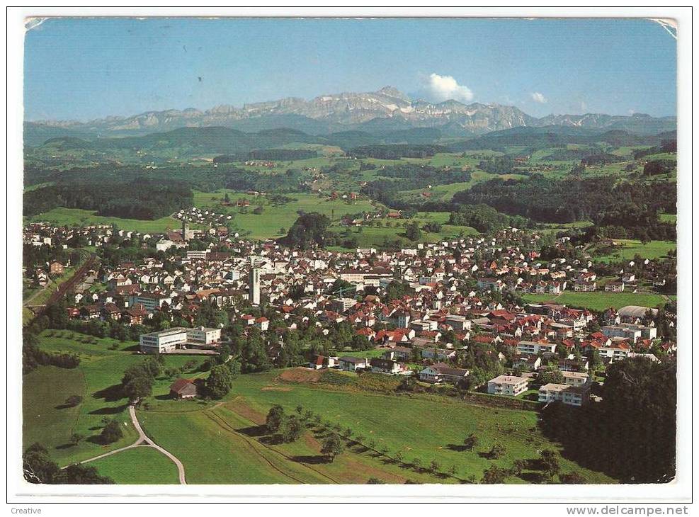 SUISSE-SCHWEIZ-SWITZERLAND.  Flugaufnahme FLAWIL Mit Säntiskette - Flawil