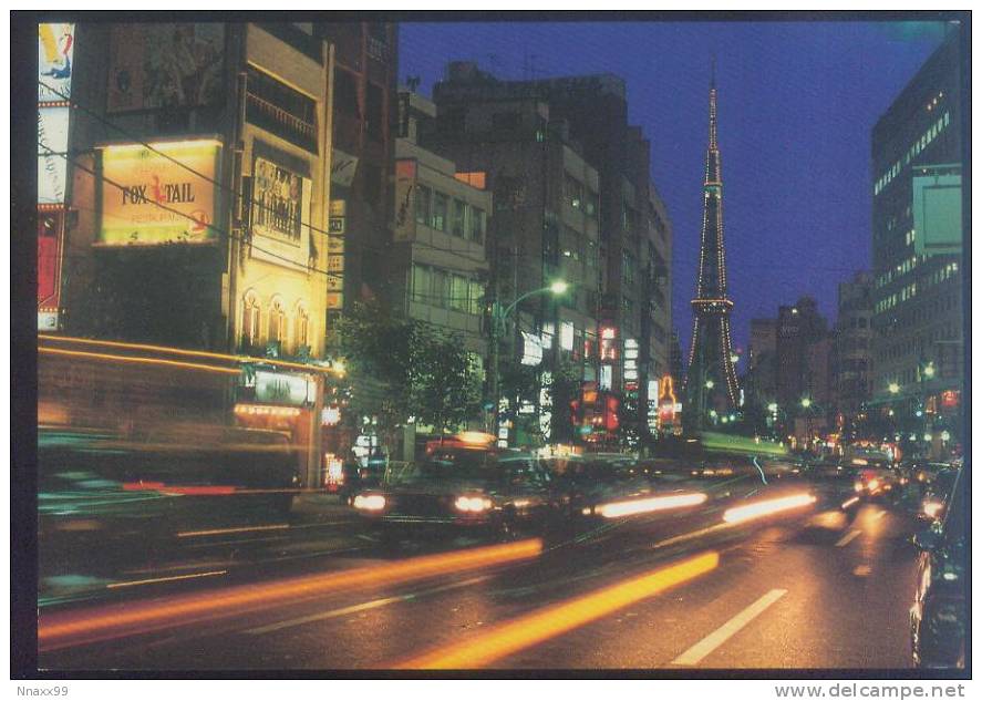 Japan - Roppongi At Night Swings As Tokyo Tower Looms Quietly In The Distance - Tokyo