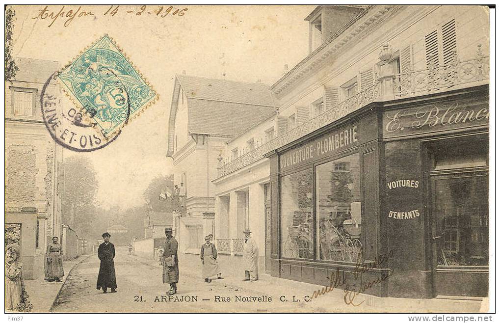 ARPAJON -  Rue Nouvelle - CPA Animée - Voy. 1906, Léger Défaut D'angle - Arpajon