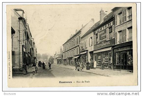 Cpa ESSONNES Rue De Paris  COMMERCES Librairie Imprimerie Photographe Marbrerie Beaugeard Ed - Essonnes