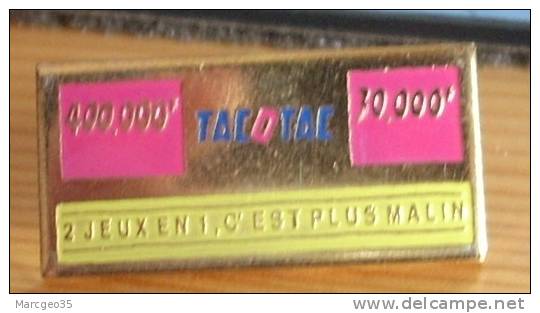 Pin's Tac O Tac Rose, 400.000F, 30.000F, "2 Jeux En 1, C'est Plus Malin" - Jeux