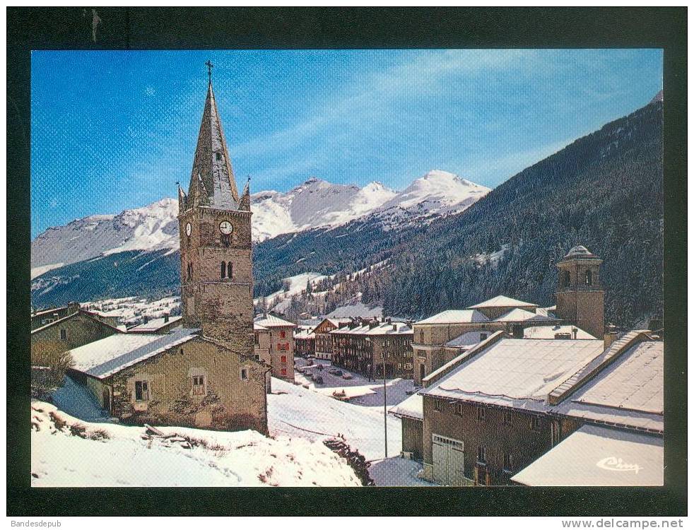 Val Cenis - Lanslebourg - Eglise - Au Fond Vue Partielle Des Pistes  (  COMBIER CIM) - Val Cenis