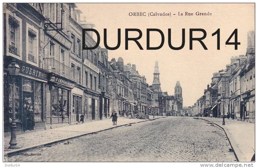ORBEC ( Calvados).  La Grande Rue  ( Bon état / Commerces /  Couleur Bleutée) - Orbec