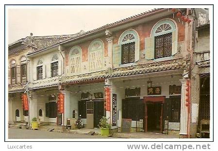 THESE OLD SHOP HOUSES IN MALACCA SHOW AN EXAMPLE OF TYPICAL OLD CHINESE ARCHITECTURAL CONSTRUCTION. - Malaysia