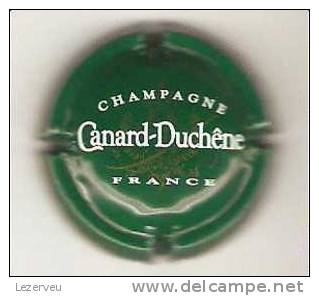 CAPSULE DE MUSELET CHAMPAGNE CANARD DUCHENE BLANC FOND VERT - Canard Duchêne