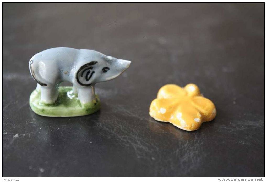 2  FEVES -FIGURINES - PETITS OBJETS DE VITRINE OU DECORATION POUR LA CRECHE - ELEPHANT+ FLEUR - Santons