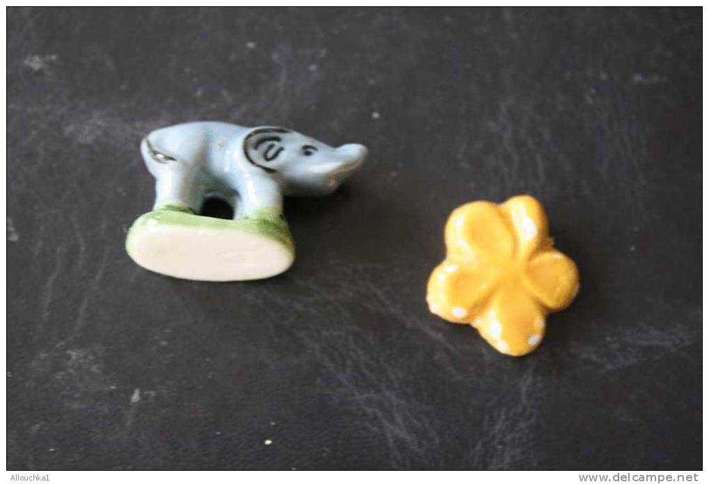 2  FEVES -FIGURINES - PETITS OBJETS DE VITRINE OU DECORATION POUR LA CRECHE - ELEPHANT+ FLEUR - Santons