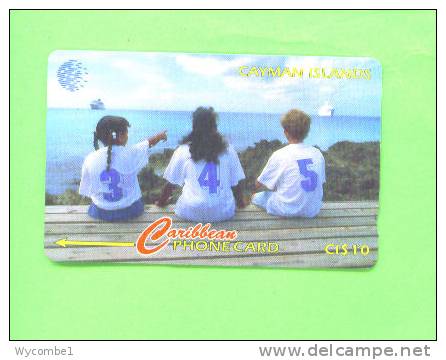 CAYMAN ISLANDS - Magnetic Phonecard/New Area Code - Islas Caimán