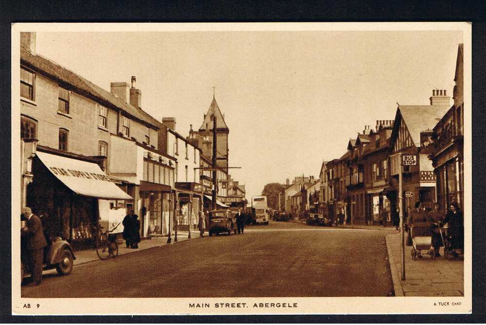 RB 584 - Raphael Tuck Postcard Main Street Abergele Denbighshire Wales - Bus Stop - Pram - Cars - Shops - Denbighshire