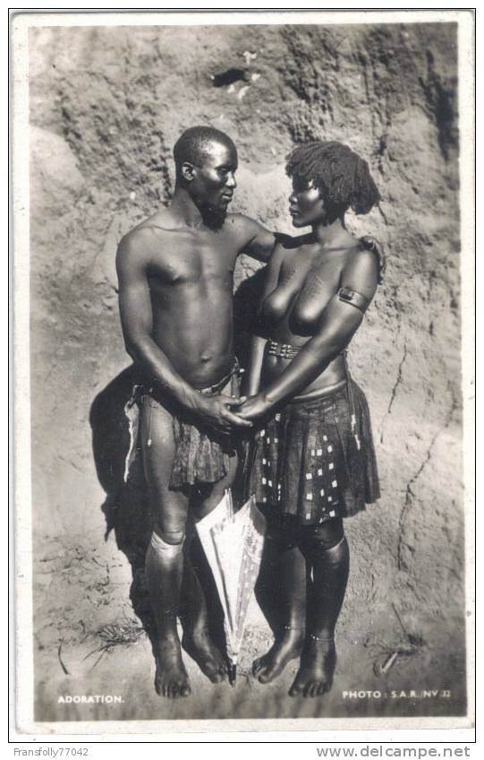 Rppc - AFRICAN COUPLE - Adoration - MALE In LOIN CLOTH - FEMALE Topless HOLDING UMBERELLA - Non Classificati