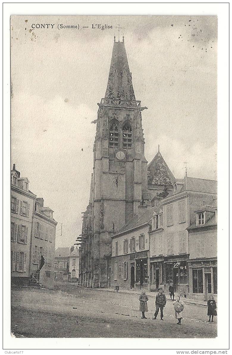 Conty (80) : La Place Près De L'église, Fillette Avec Du Pain  Env 1910 (animée, Commerces). - Conty