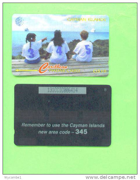 CAYMAN ISLANDS - Magnetic Phonecard/New Area Code - Isole Caiman