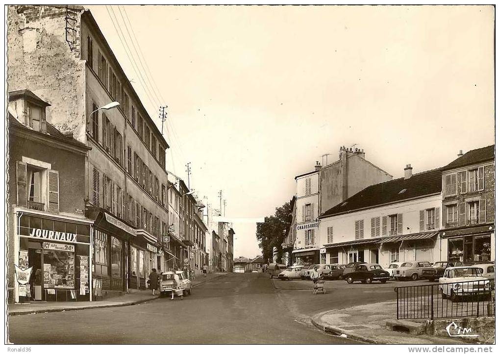 CP BIEVRES Rue De Paris Habitations Commerce Journaux Chaussures Charcuterie Comestibles Du Parc Peugeot Citroen Renault - Bievres