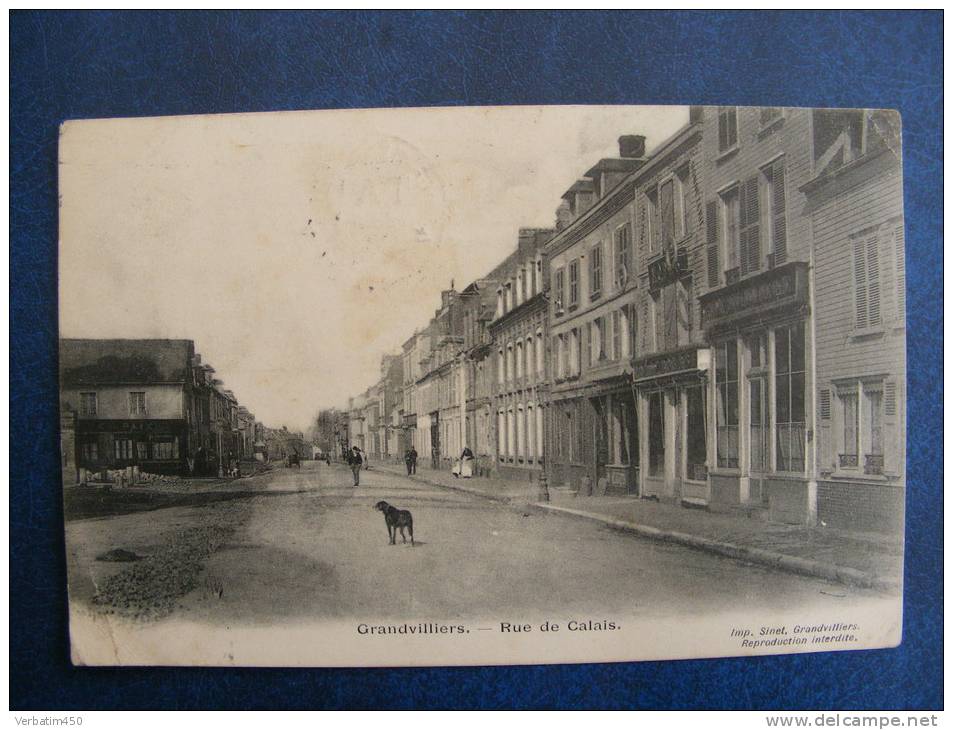 CP ....GRANDVILLIERS..RUE DE CALAIS..PLAN ANIME..COMMERCE..1907..2 PHOTOS - Grandvilliers