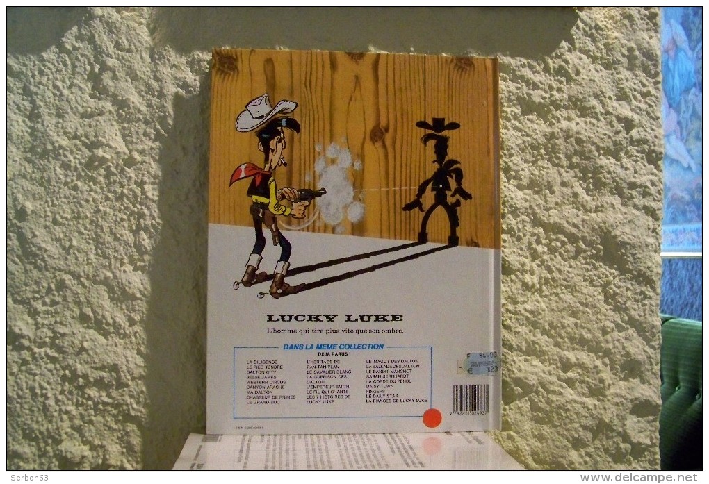 LIVRE LUCKY LUKE NEUF INVENDUS LIBRAIRIE FINGERS DESSIN MORIS SCENARIO DE LO HARTOG VAN BANDA EDITION DARGAUD - Lucky Luke