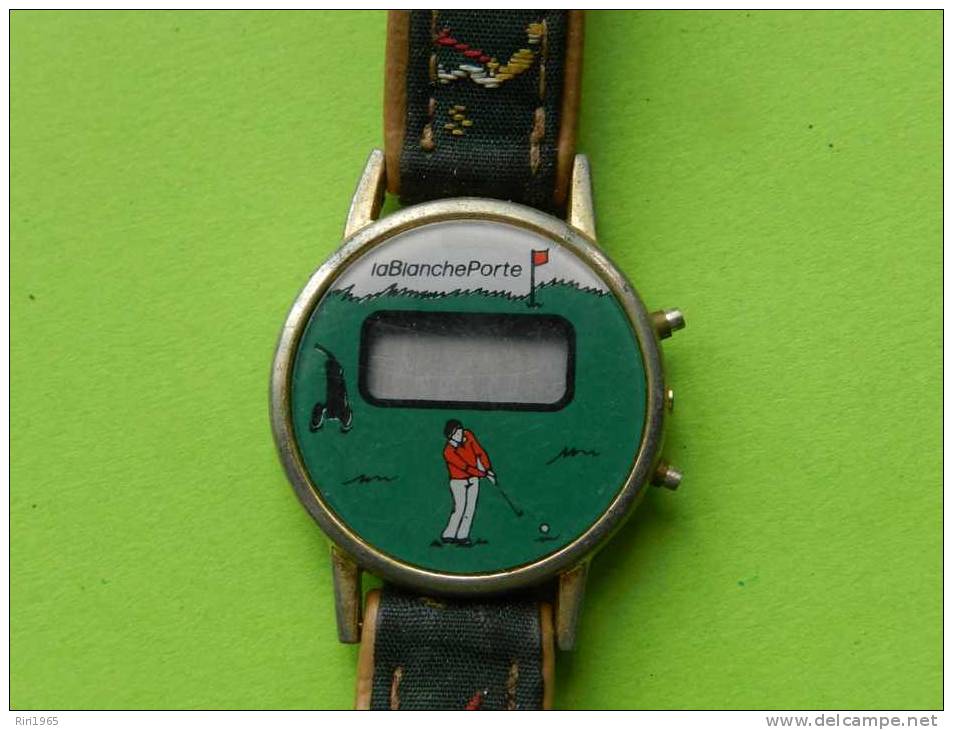 Montre Bracelet Femme -blanche Porte-(quartz ,pile Hs)motif Golf - Montres Publicitaires