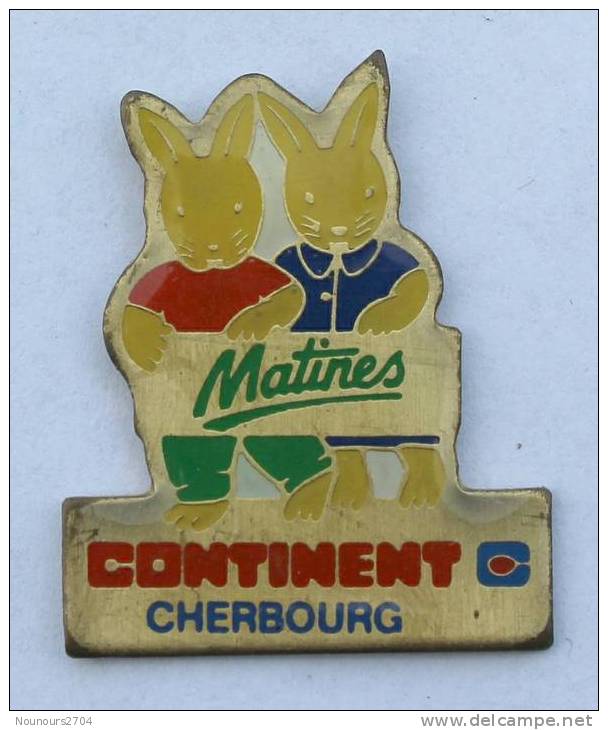 Pin's CONTINENT Hypermarché - CHERBOURG (50) - Oeufs Matiens - Lapins -  B1135 - Marcas Registradas