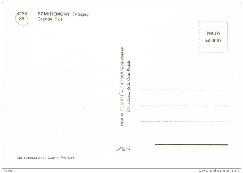 CPM REMIREMONT  Un Coin De La Ville  Avec La Grande Rue  Et Ses Commerces - Remiremont