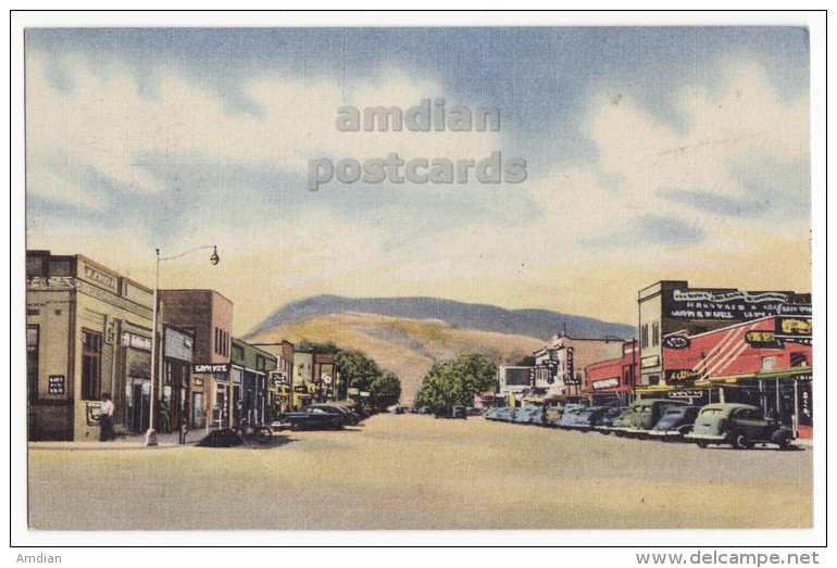 USA, CODY WYOMING WY, MAIN STREET AND BUSINESS DISTRICT, RATTLESNAKE MOUNTAIN, 1950s Vintage Postcard  [4035] - Cody