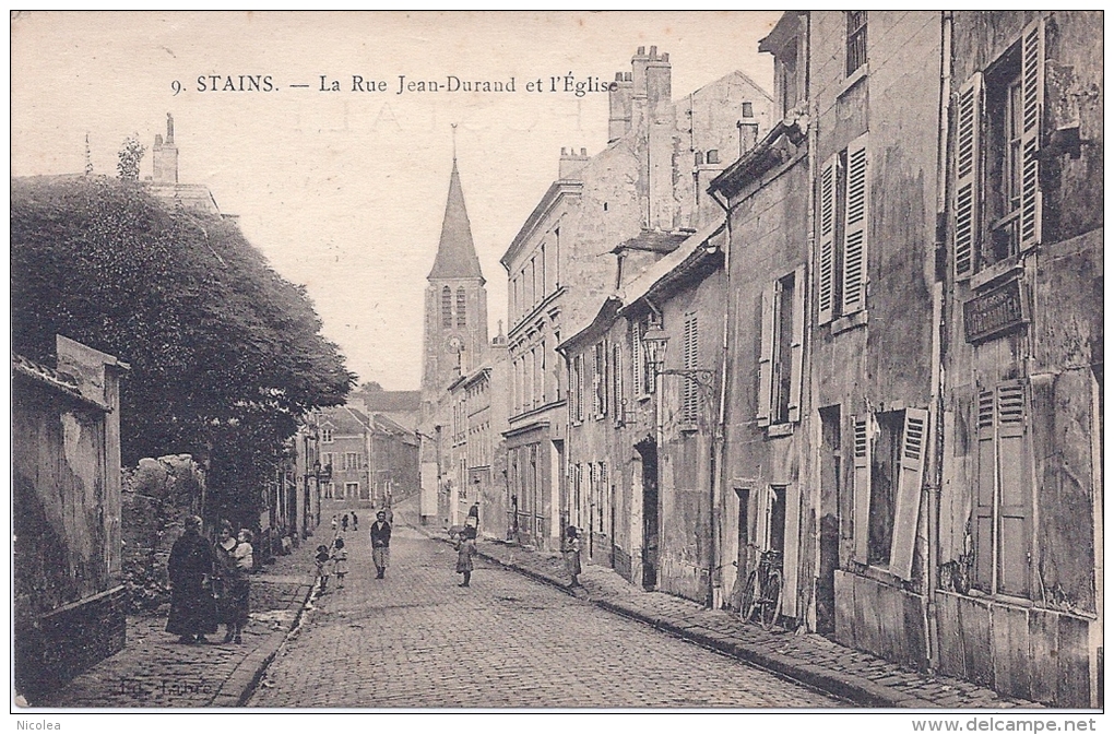 CPA 93 STAINS RUE JEAN DURAND ANIMEE 1925 ECHOPPE DE CORDONNIER - Stains