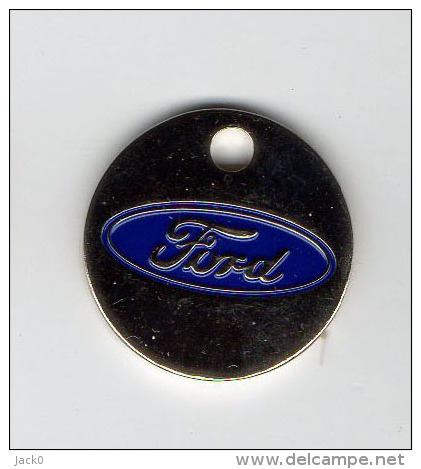 Jeton  De   Caddie  Argenté  Automobile  FORD  Verso  Est  Auto  Besançon  écrit  En  Blanc - Trolley Token/Shopping Trolley Chip