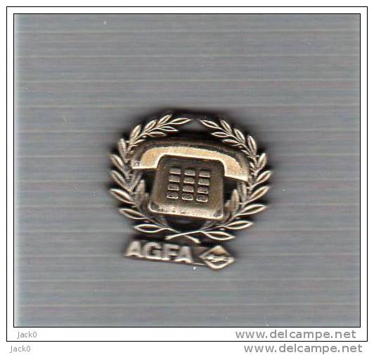 Pin´s  Marque  AGFA , ARTHUS  BERTRAND  Téléphone  Argenté - Arthus Bertrand