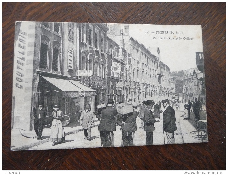 CPA Thiers. Rue De La Gare Et Le Collège. Magasin Coutellerie, Imprimerie,;;;Animée - Thiers