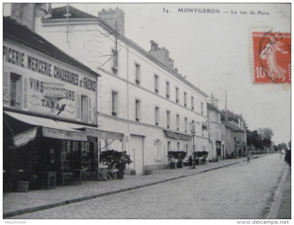 CPA Montgeron.La Rue De Paris. Epicerie Mercerie Tabac. - Montgeron