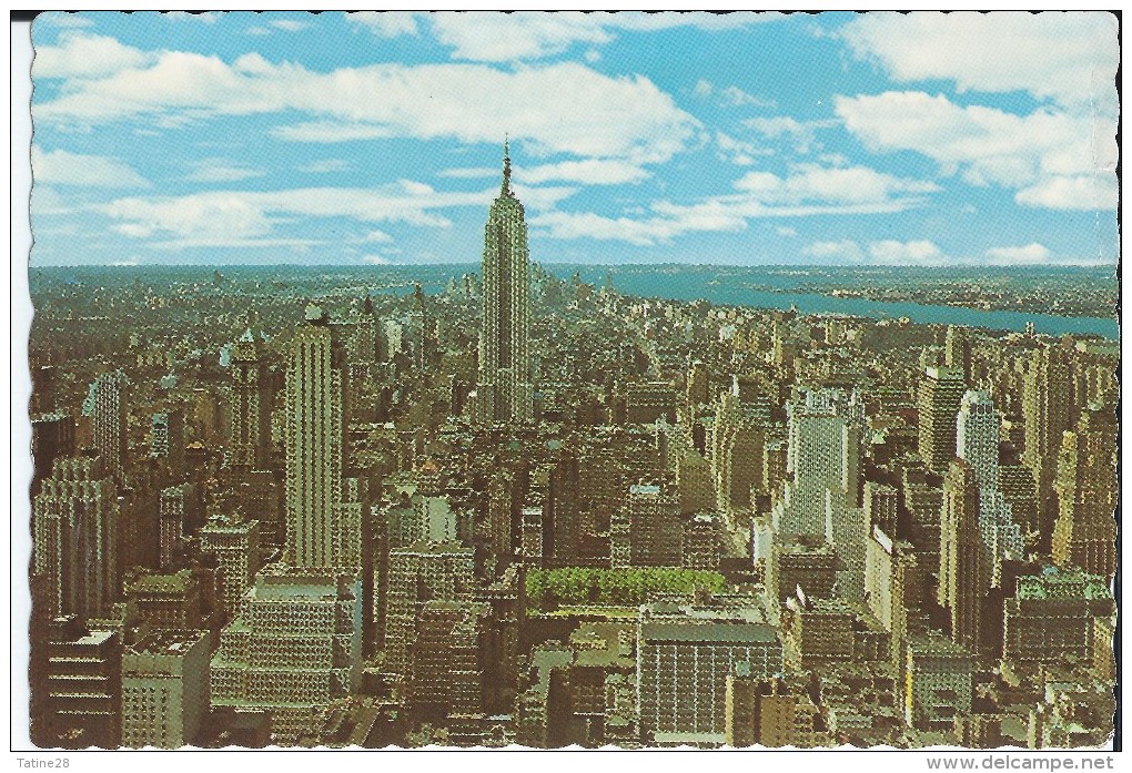 THE EMPIRE STATE BUILDING RISES MAJESTICALLY ABOVE THIS PANORAMIC VIEW OF THE NEW YORK CITY - Empire State Building