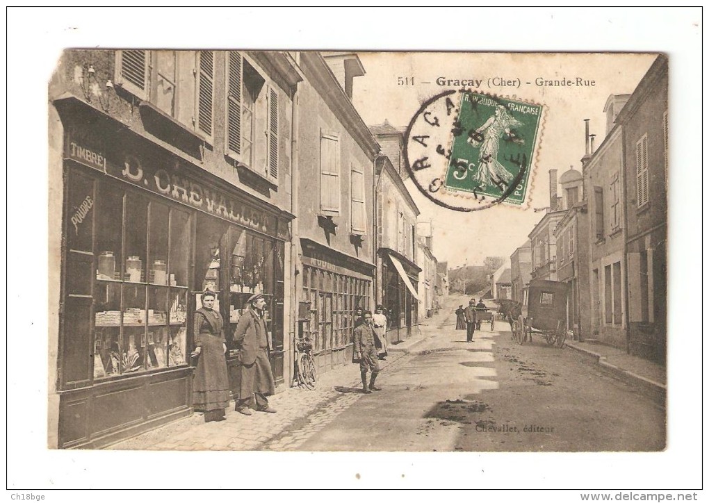 CPA 18 - Graçay : Grande Rue : Animation - Boutique Chevallet ( éditeur) Attelage - Maisons - Peu Commune - Graçay