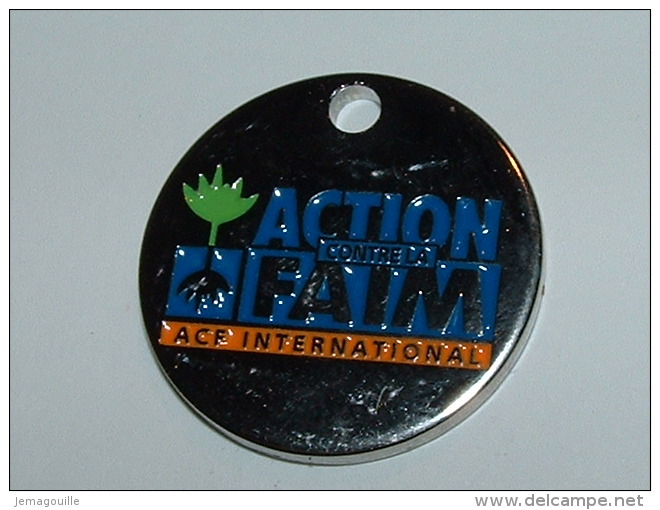 Jeton De Caddies - ACTION CONTRE LA FAIM INTERNATIONAL - Trolley Token/Shopping Trolley Chip