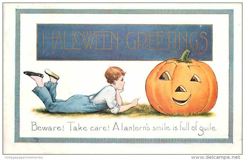 225403-Halloween, Whitney No WNY12-1, Boy Lying On Ground Facing Jack O Lantern - Halloween