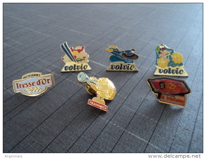 LOT DE 6 PIN'S  VOLVIC/TRESSE D'OR/LA TRINITAINE/JEANNETTE - Lots