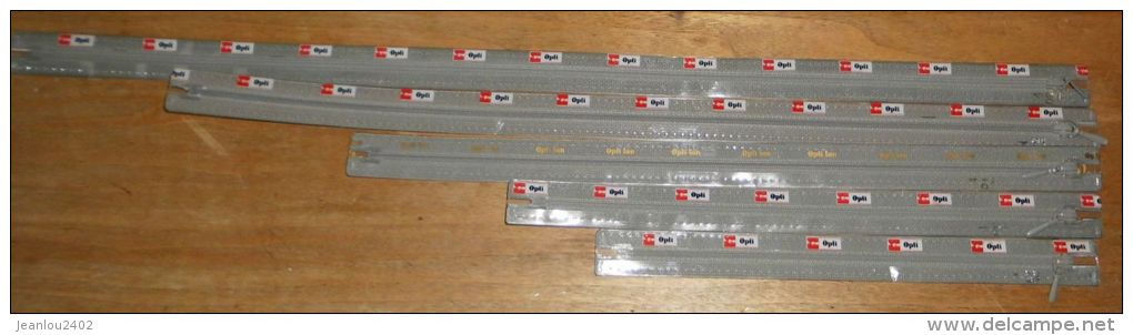 LOT DE 11 FERMETURES ECLAIR DE 25 A 60 CM MARQUE "OPTI" COULEUR GRIS - Autres & Non Classés