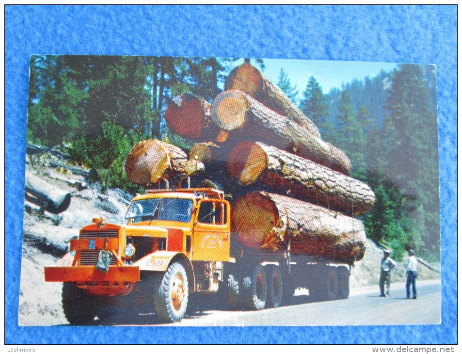 Logging Truck. One Of The Most Thrilling Sights In The West Is These Large Diesel Trucks Hauling Logs On Mountain Roads. - Autres & Non Classés