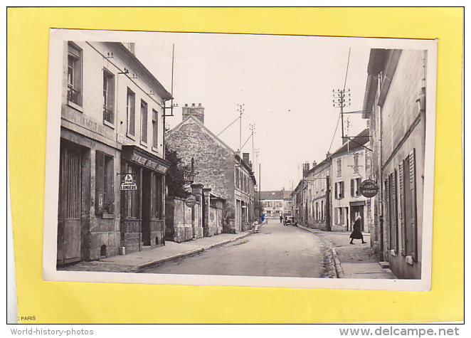 CPA - PRECY SUR OISE - 12. La Grande Rue  édition Studio Arthur - Quincaillerie épicerie Charbons - Précy-sur-Oise