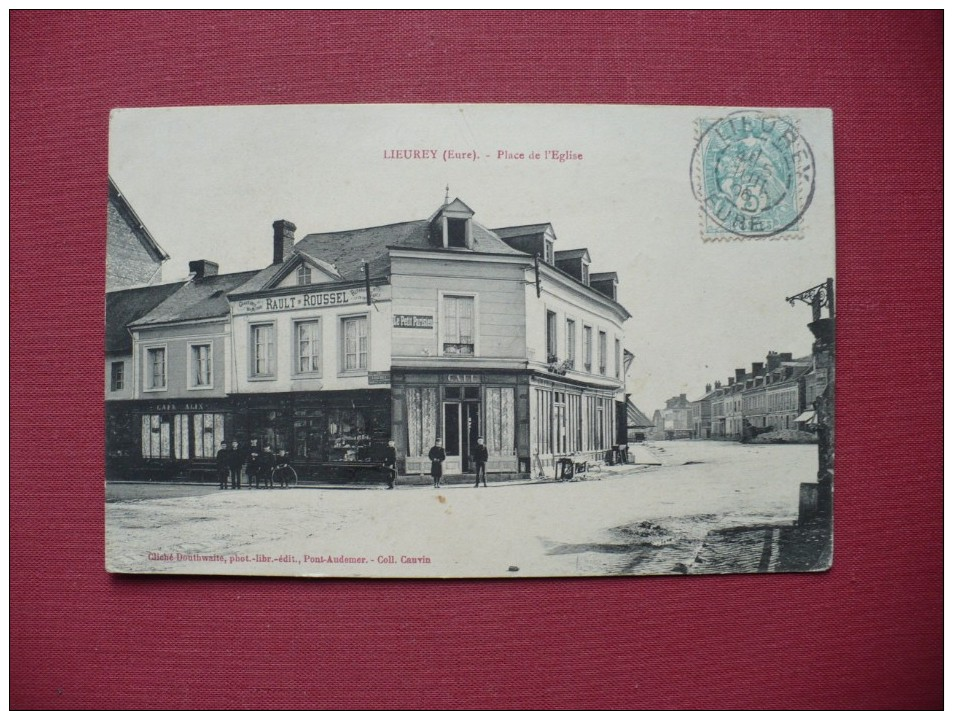 Cpa.r - Lieurey (27) - Place De L'église - Café Alix - Chaussures Rault-roussel - Café Du Petit Parisien - éd.douthwaite - Autres & Non Classés