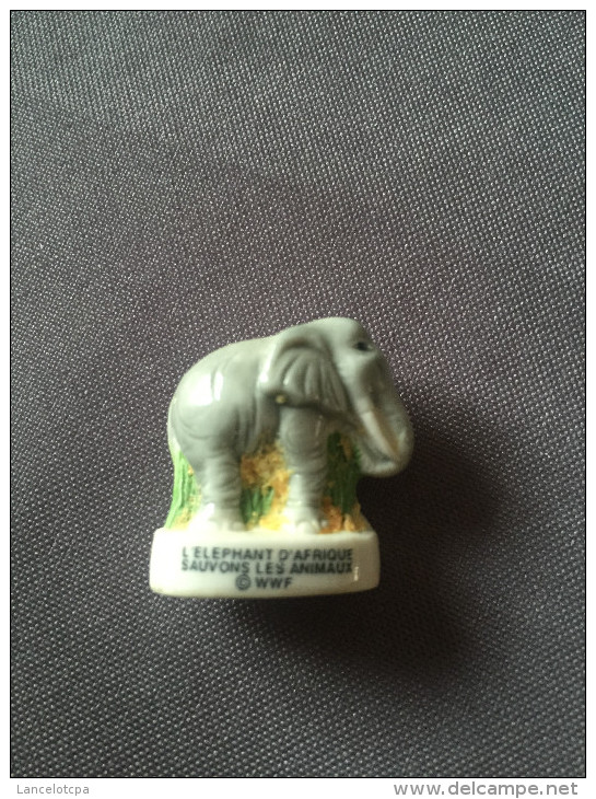 FEVE EN PORCELAINE / SERIE WWF SAUVONS LES ANIMAUX - L'ELEPHANT - Historia