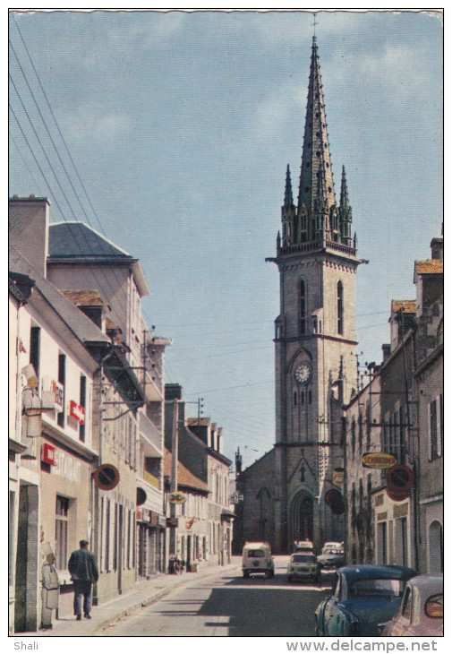 CPSM PLOUESCAT EGLISE CONSTRUITE EN 1867 ET LA RUE PRINCIPALE DU BOURG - Plouescat