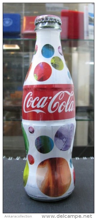 AC - COCA COLA 2014 SHRINK WRAPPED EMPTY GLASS BOTTLE & CROWN CAP DESIGNED BY ARZU KAPROL - Bottles