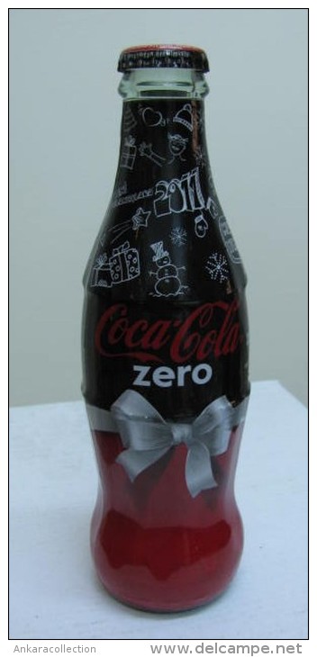 AC - COCA COLA ZERO - HAPPY NEW YEAR 2010 SHRINK WRAPPED EMPTY GLASS BOTTLE - Bottiglie