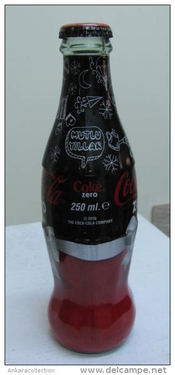 AC - COCA COLA ZERO - HAPPY NEW YEAR 2010 SHRINK WRAPPED EMPTY GLASS BOTTLE - Bouteilles