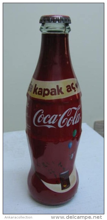 AC - COCA COLA - OPEN A CROWN TO HAPPINESS 2010 SHRINK WRAPPED EMPTY GLASS BOTTLE - Bottles