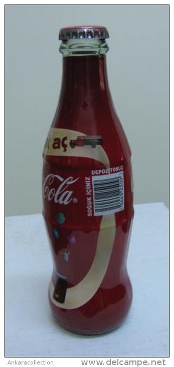 AC - COCA COLA - OPEN A CROWN TO HAPPINESS 2010 SHRINK WRAPPED EMPTY GLASS BOTTLE - Flessen