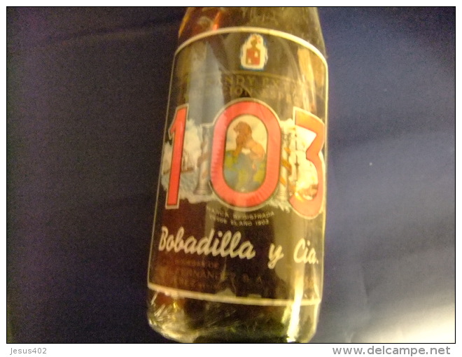 ANTIGUA BOTELLA DE 3/4 LITRO BRANDY103 ETIQUETA NEGRAaños 1960 /1970 - Licor Espirituoso