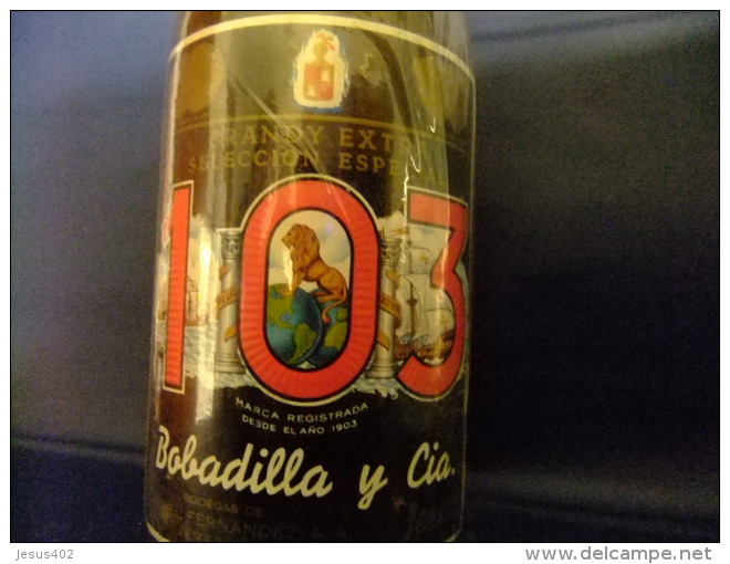 ANTIGUA BOTELLA DE 3/4 LITRO BRANDY103 ETIQUETA NEGRAaños 1960 /1970 - Licor Espirituoso