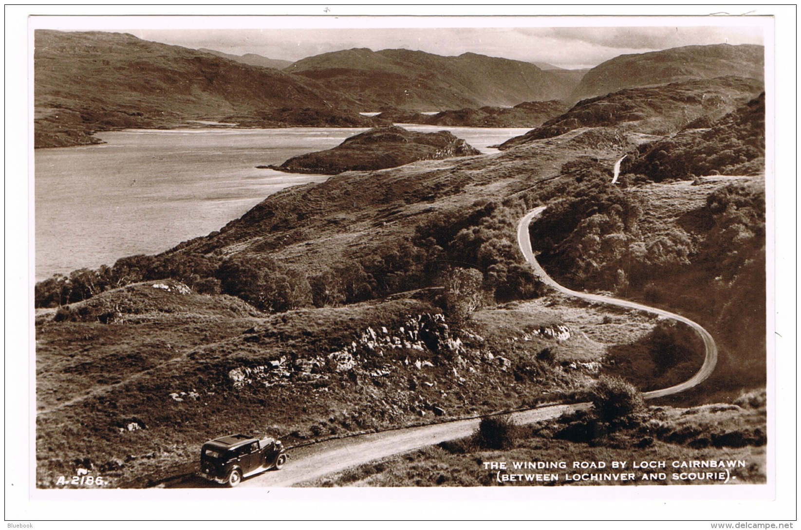 RB 1096 -  Real Photo Postcard - Car - Winding Road By Loch Cairnbawn - Sutherland Scotland - Sutherland