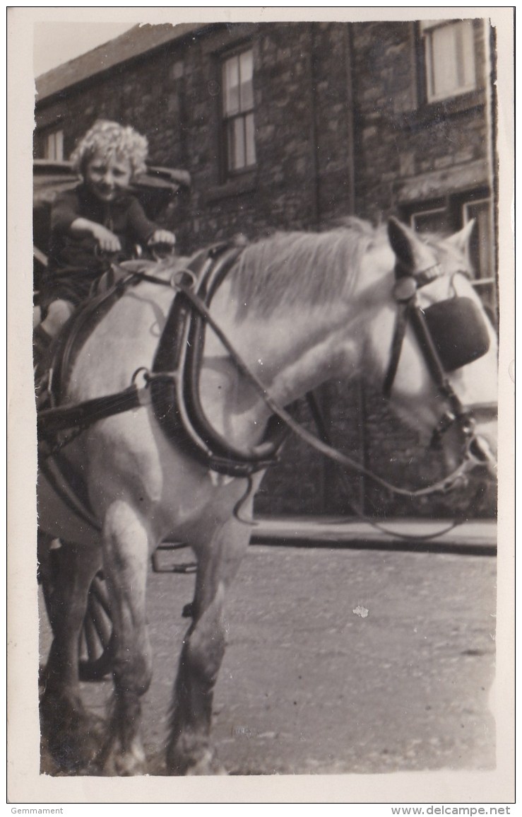 SMALL CHILD ON LARGE HORSE - Unclassified