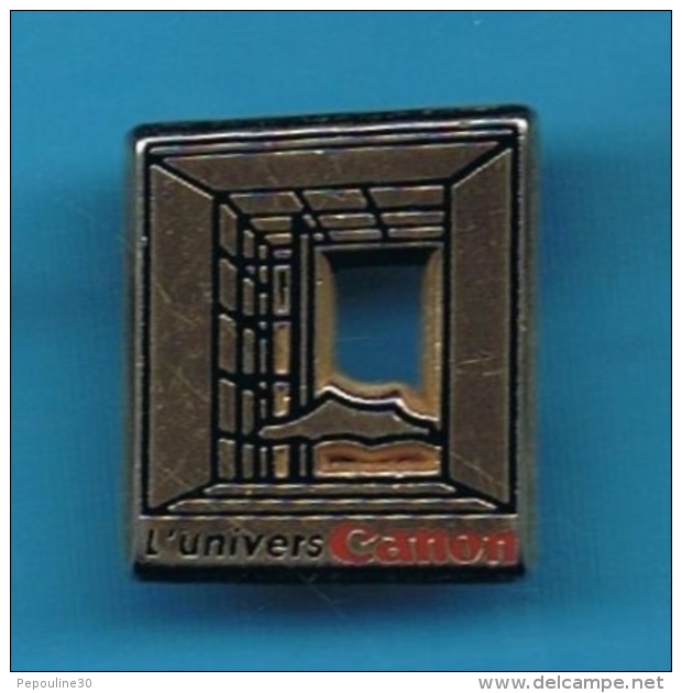 1 PIN'S  //  ** L'UNIVERS CANON ** . (Arthus Bertrand Paris) - Informatique